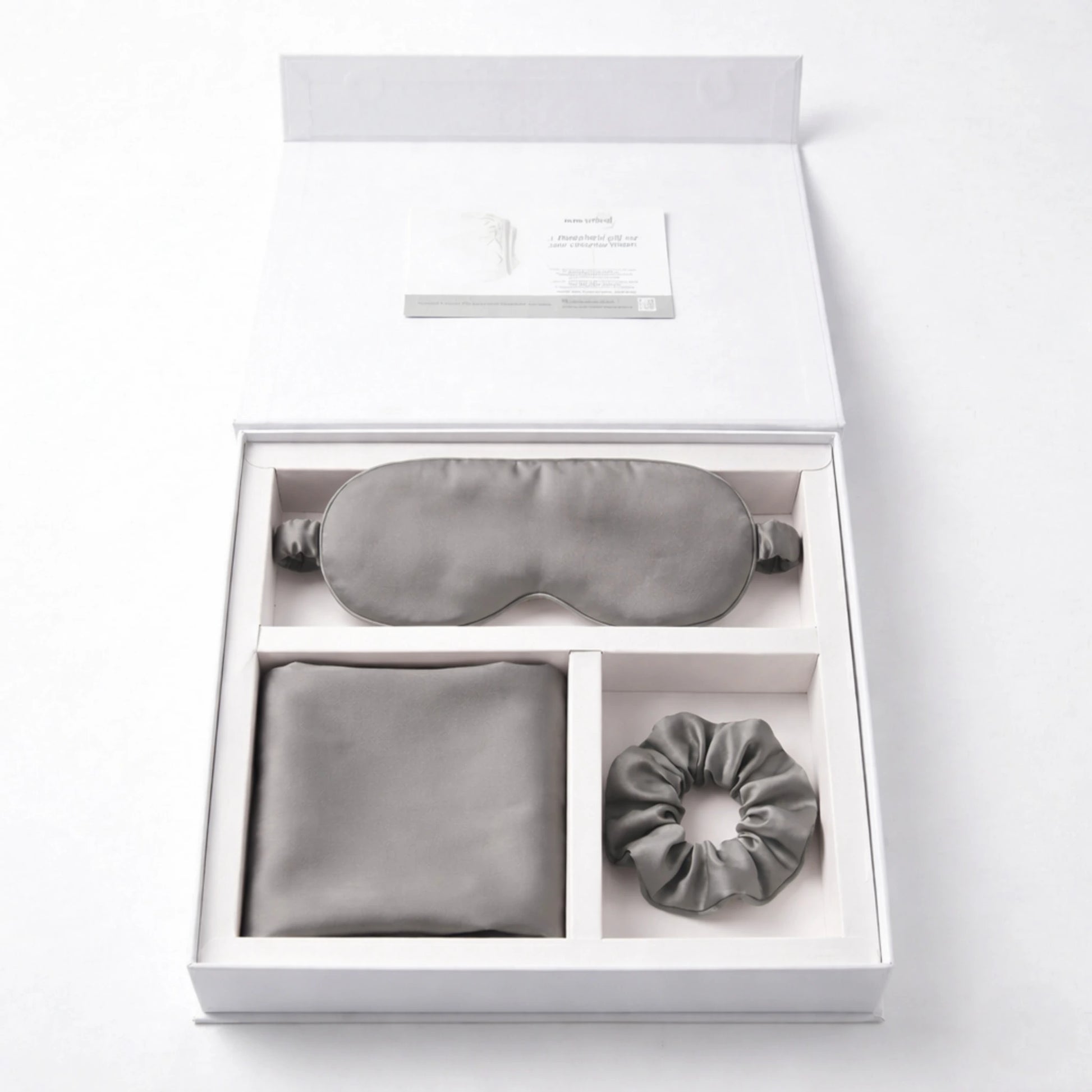 Essential Sleep Solution™ bamboo lyocell gift set in Grey featuring two pillowcases, eye mask and scrunchie beautifully presented in a premium gift box.