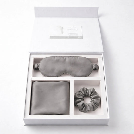 Grey bamboo lyocell Essential Sleep Set — eye mask, pillowcase pair and scrunchie flatlay