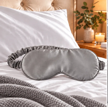 Grey bamboo lyocell sleep eye mask with adjustable strap, smooth and gentle on skin.