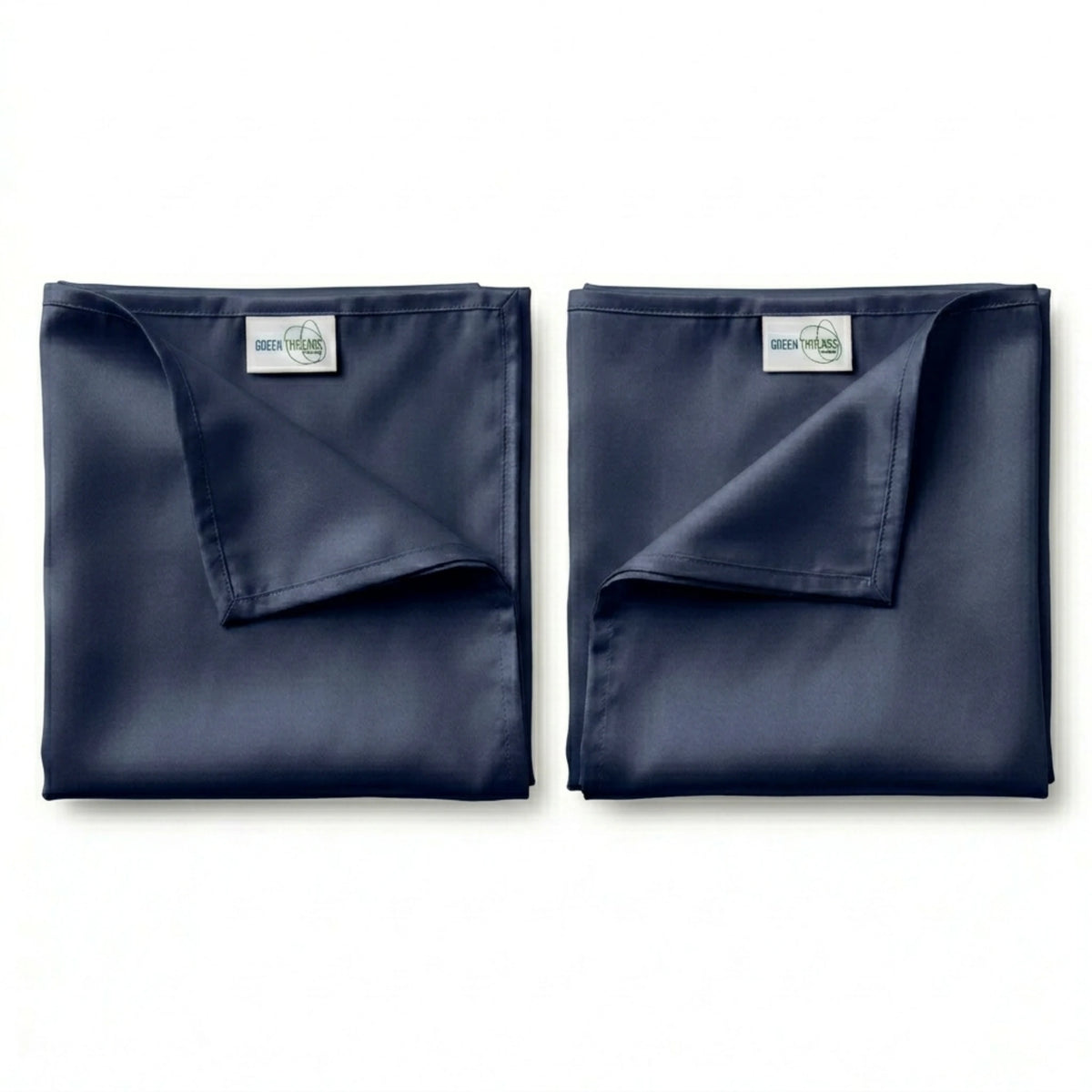 Pair of navy bamboo lyocell pillowcases for cooler sleep and gentle care for hair and skin.