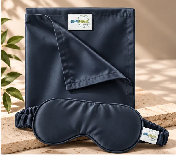 The Sleep Duo in navy: folded bamboo lyocell pillowcase with matching sleep eye mask.