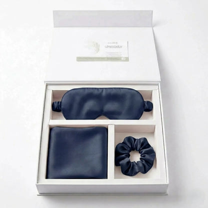 Essential Sleep Solution™ bamboo lyocell gift set in Navy featuring two pillowcases, eye mask and scrunchie beautifully presented in a premium gift box.