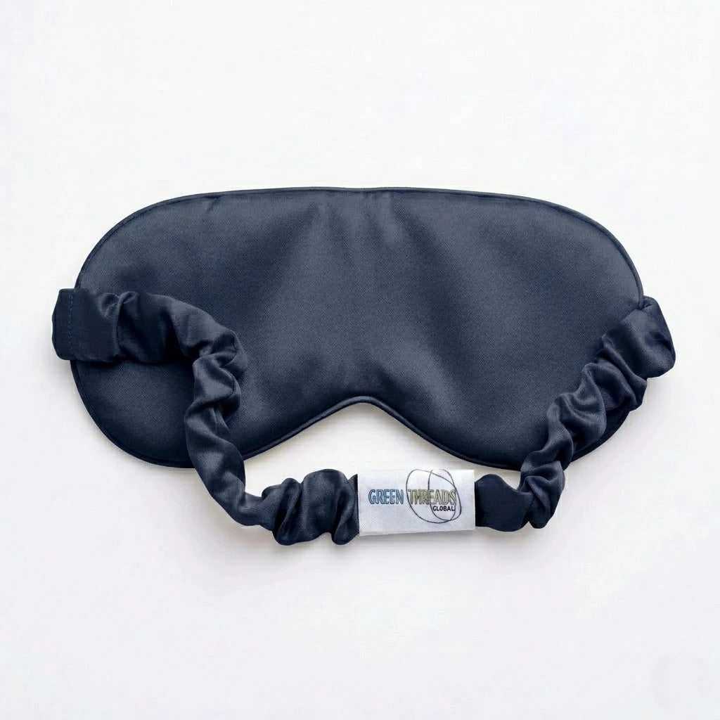 Navy bamboo lyocell sleep eye mask — reverse side showing soft inner lining and logo detail.