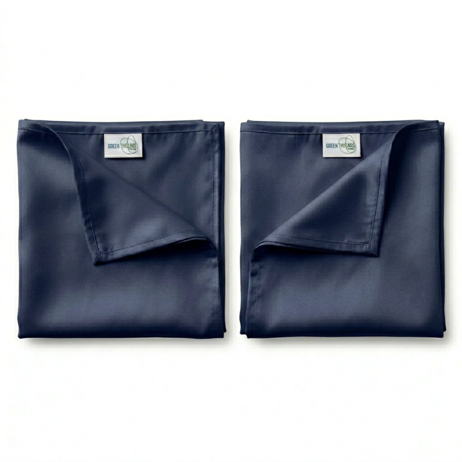 Pair of premium bamboo lyocell pillowcases in Navy designed for cooler sleep and gentle care for hair and skin.