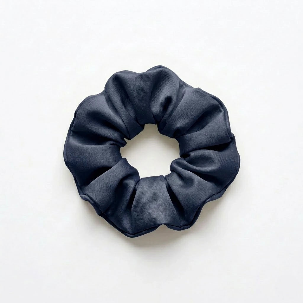 Bamboo lyocell hair scrunchie in Navy designed to help reduce hair breakage and friction.