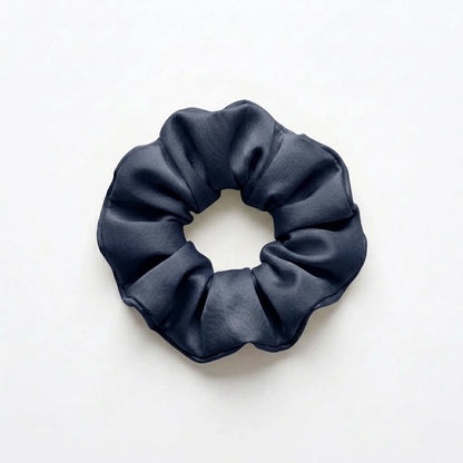 Bamboo lyocell hair scrunchie in Navy designed to help reduce hair breakage and friction.