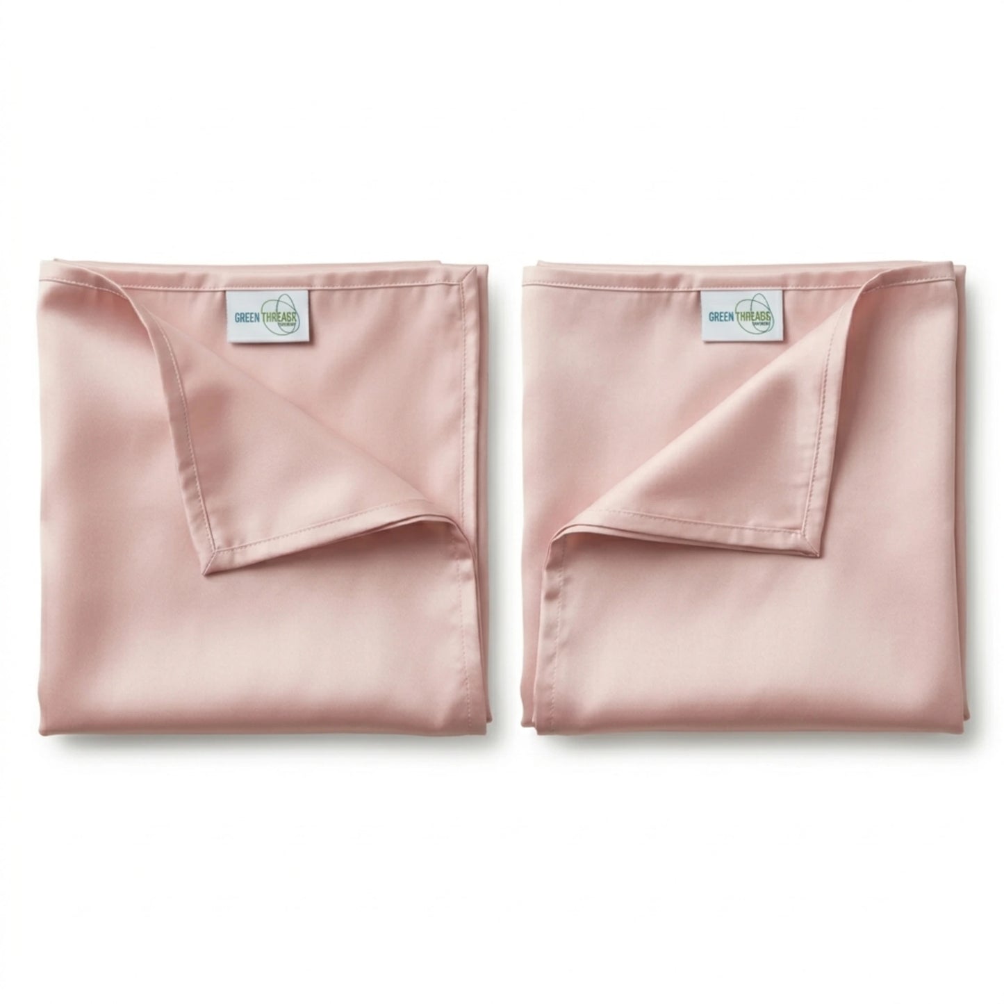 Pair of premium bamboo lyocell pillowcases in Pink designed for cooler sleep and gentle care for hair and skin.