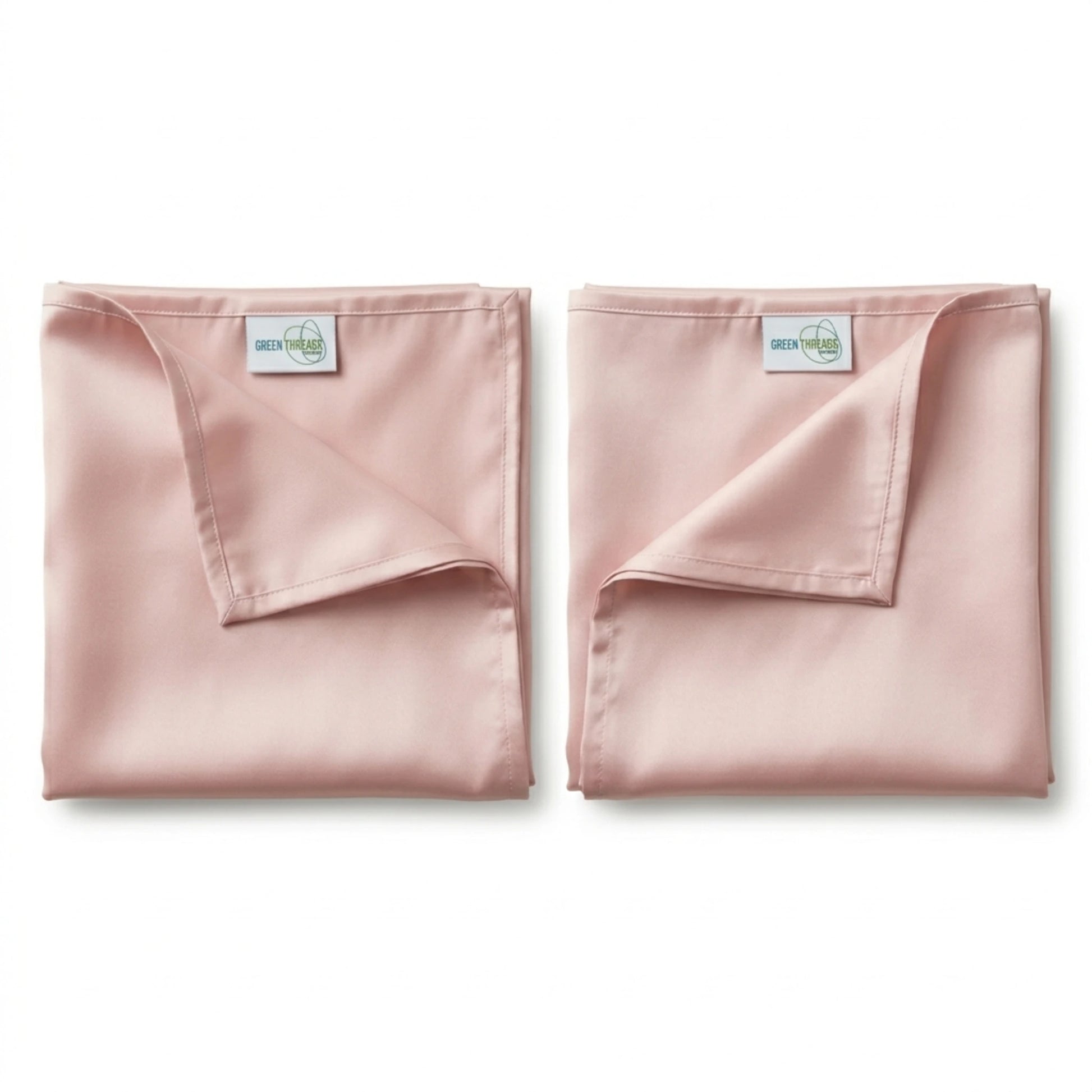 Pair of premium bamboo lyocell pillowcases in Pink designed for cooler sleep and gentle care for hair and skin.