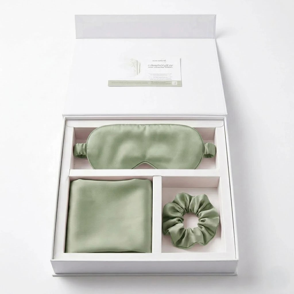 Essential Sleep Solution™ bamboo lyocell gift set in Sage featuring two pillowcases, eye mask and scrunchie beautifully presented in a premium gift box.