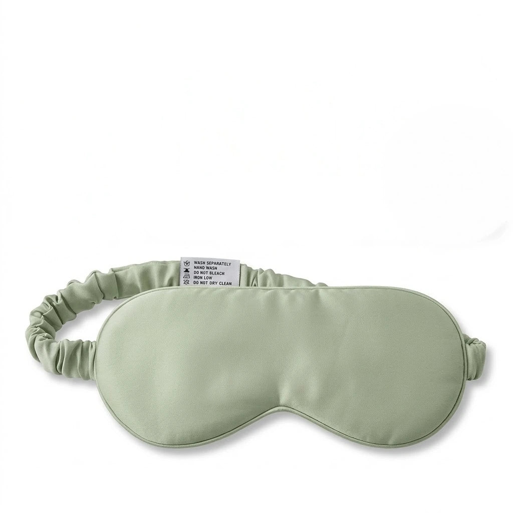 Sage bamboo lyocell sleep eye mask — front view showing contoured design.