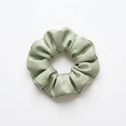 Bamboo lyocell hair scrunchie in Sage designed to help reduce hair breakage and friction.