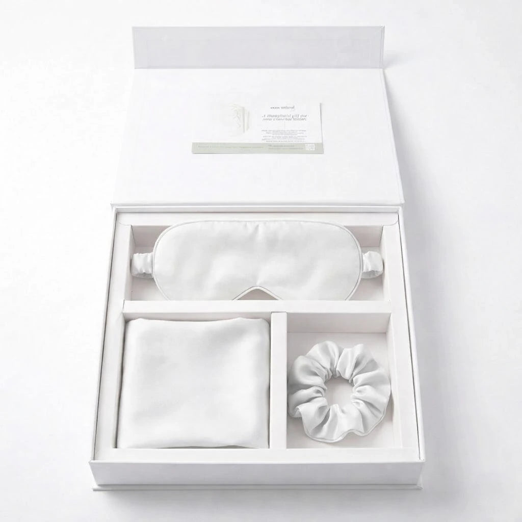 Essential Sleep Solution™ bamboo lyocell gift set in White featuring two pillowcases, eye mask and scrunchie beautifully presented in a premium gift box.