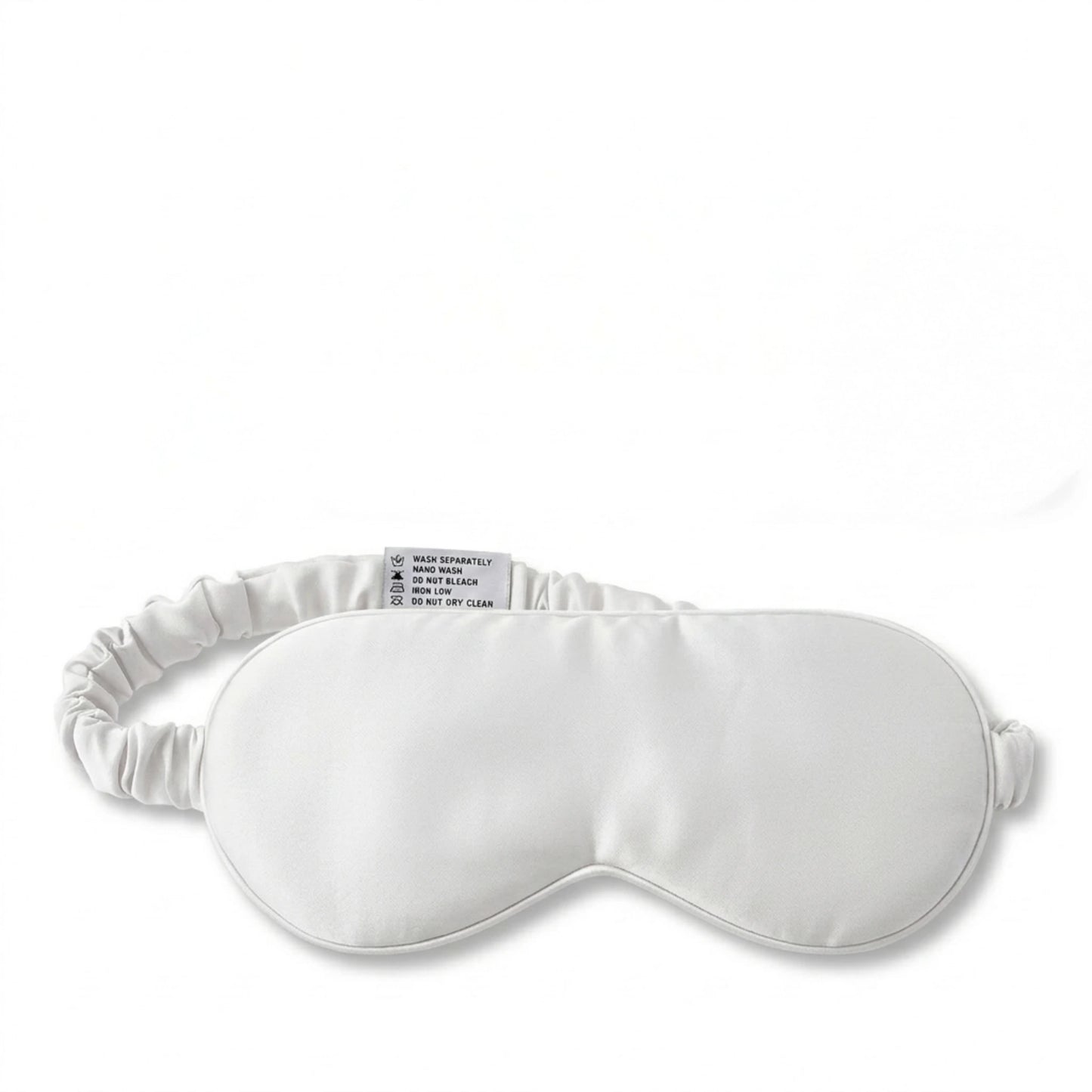 White bamboo lyocell sleep eye mask — front view showing contoured blackout design.
