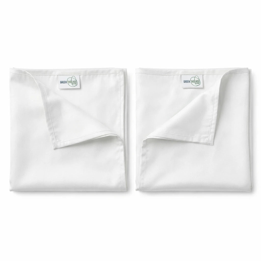Pair of premium bamboo lyocell pillowcases in White designed for cooler sleep and gentle care for hair and skin.