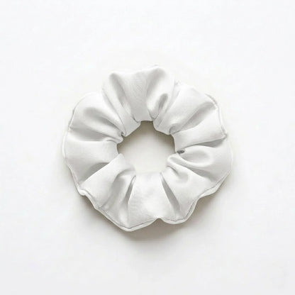 Bamboo lyocell hair scrunchie in White designed to help reduce hair breakage and friction.
